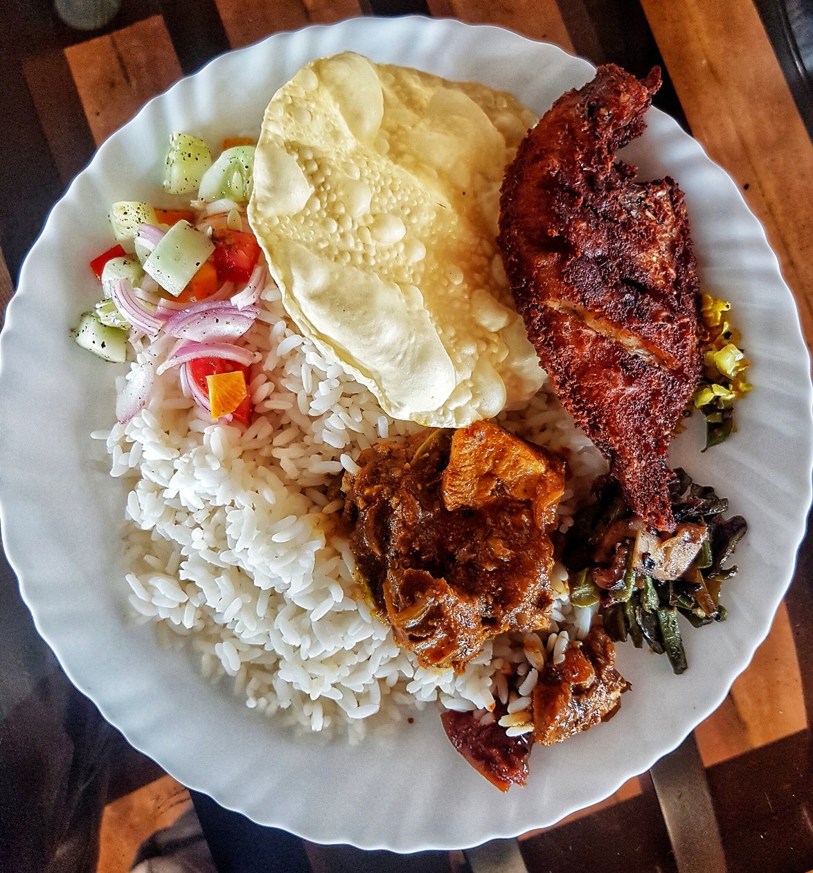 Kerala meal with karimeen fry